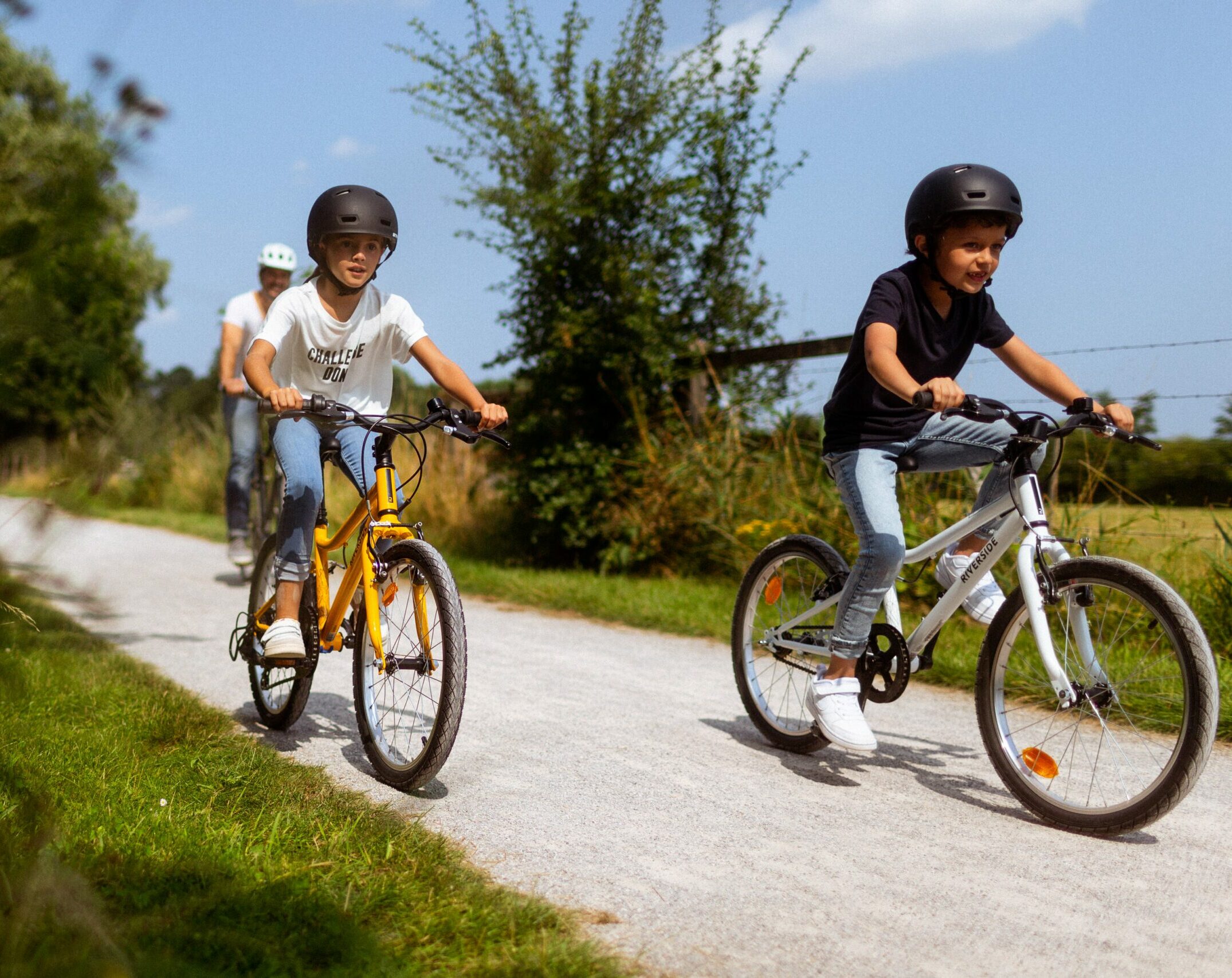 Children cycling in a park on a sunny day