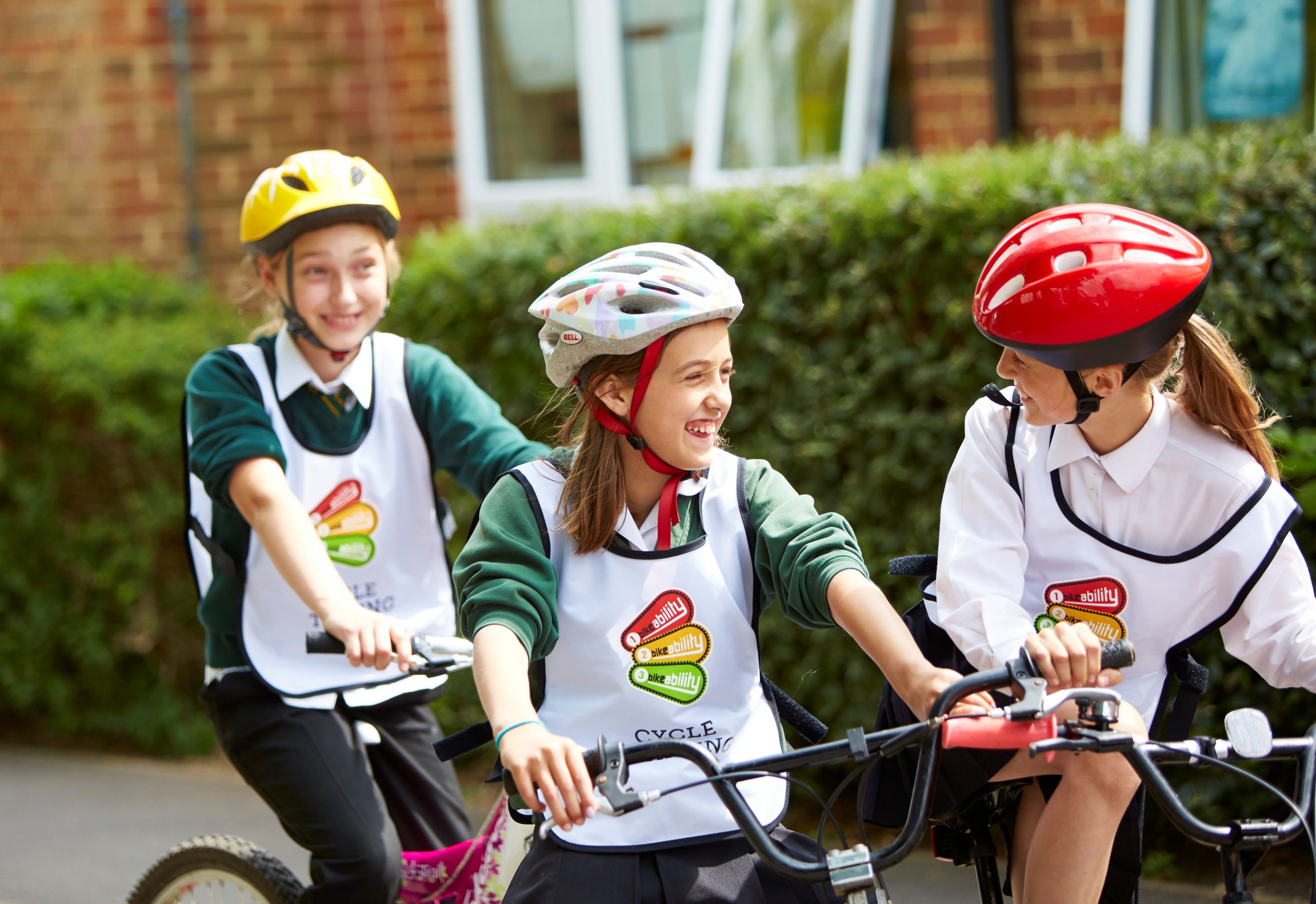 Three Bikeability trainees enjoying their lessons