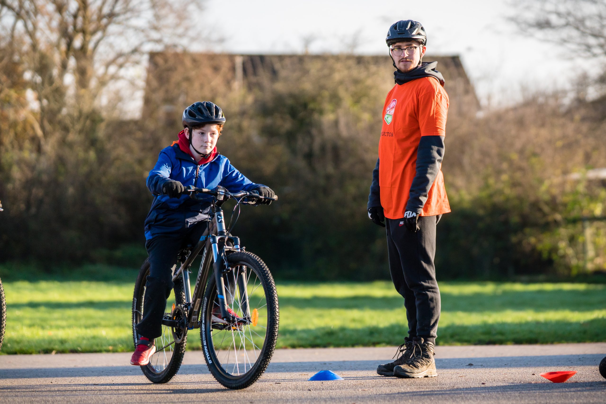 A young boy during a Bikeability session with an instructor