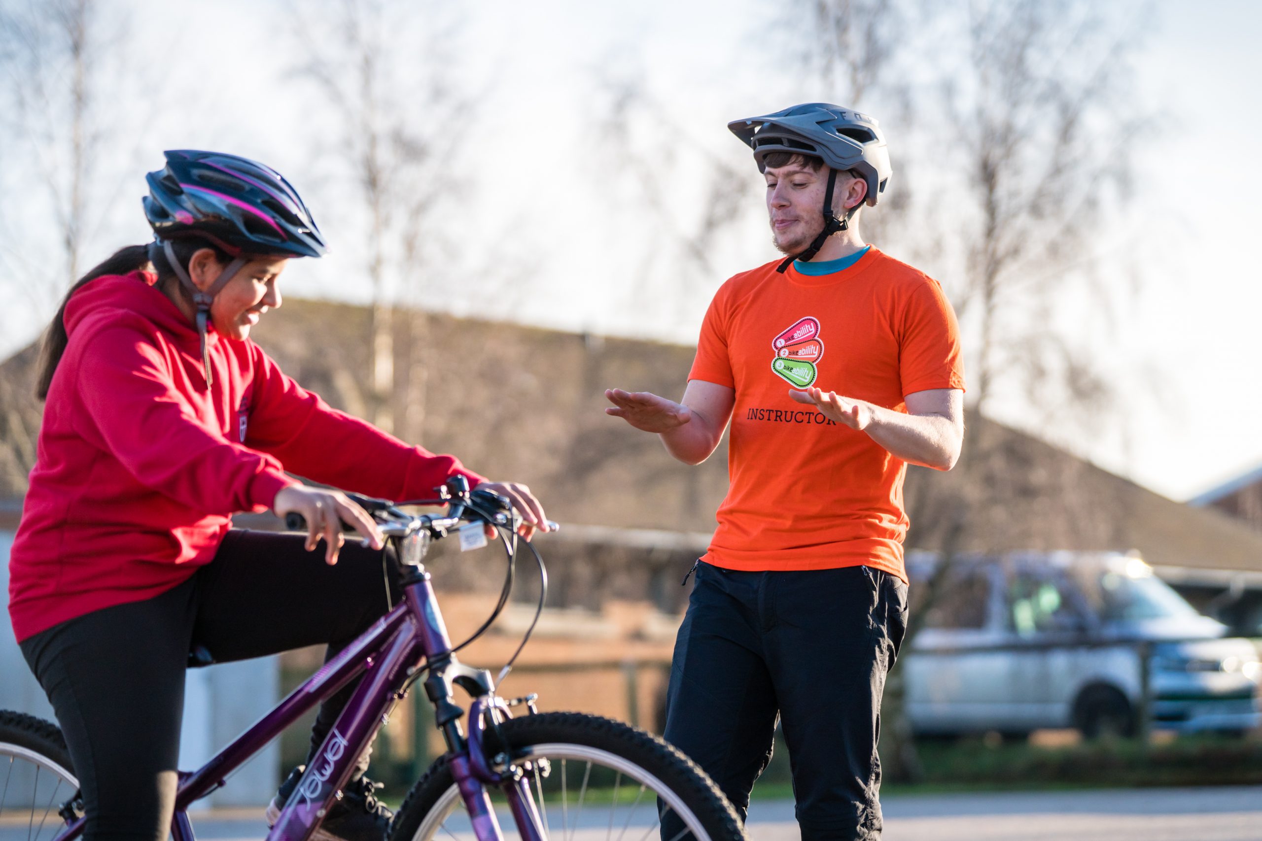 An instructor teaches a child during a Bikeability session