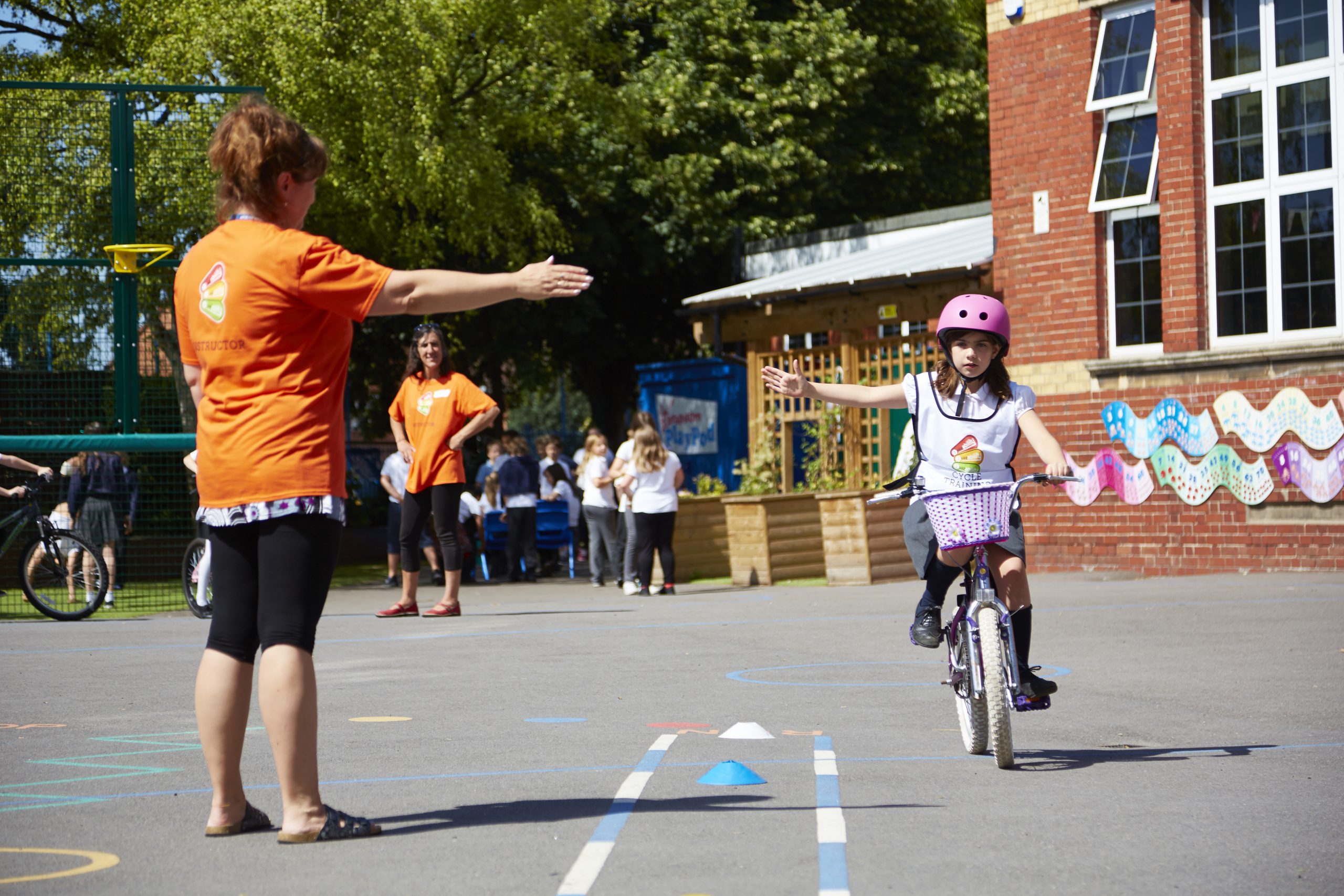 Bikeablitity instructor with young girl.