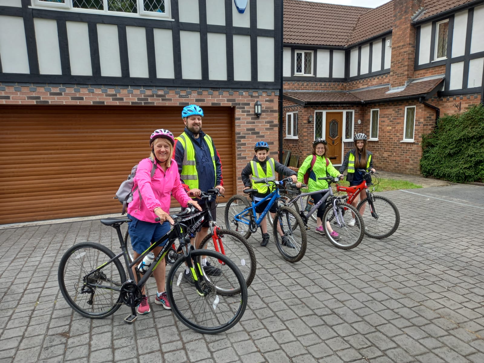 Family with their bikes ready to go out on a cycle ride