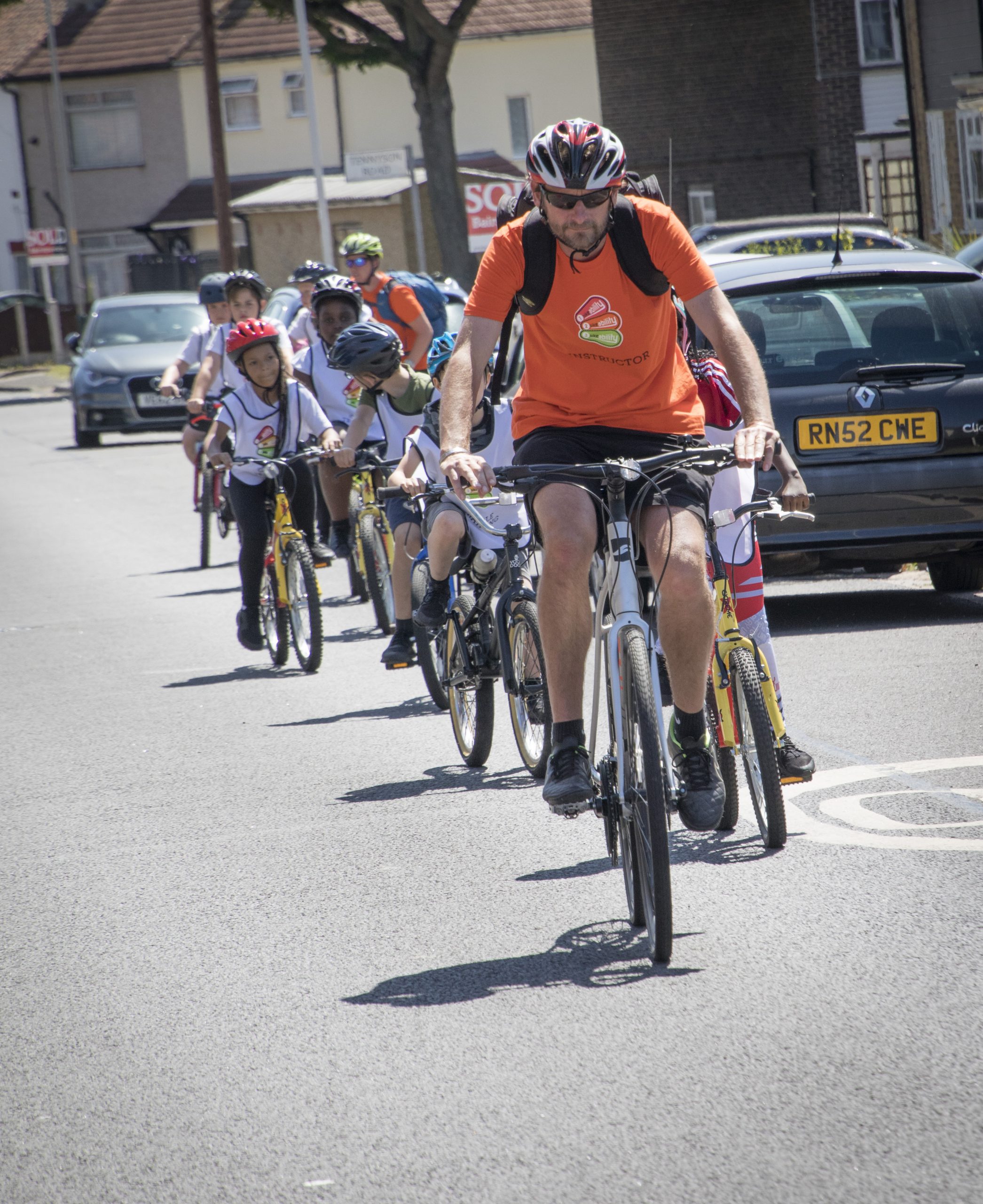 Bikeability instructor leading a lesson on the road