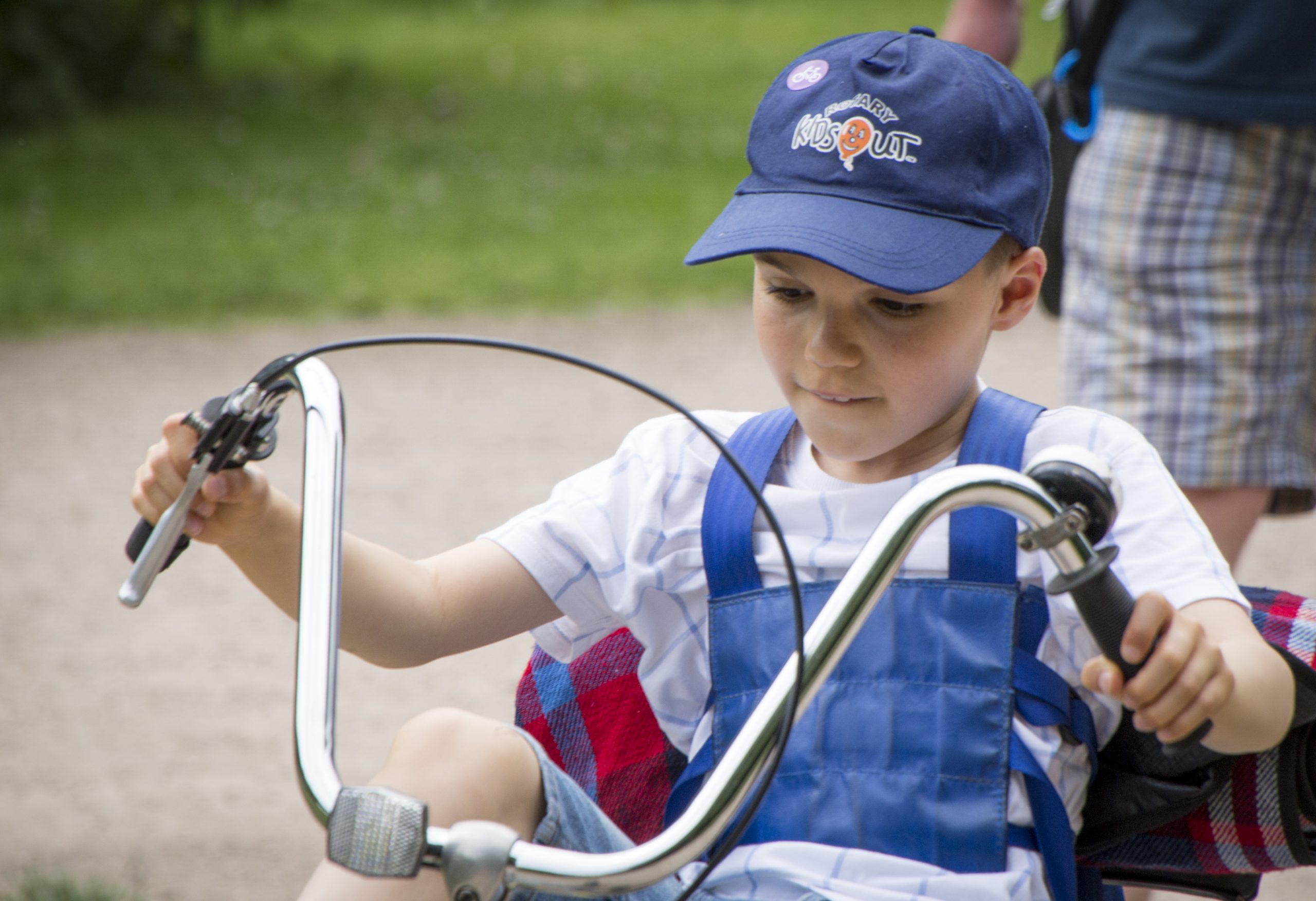 Young child using accessible cycle