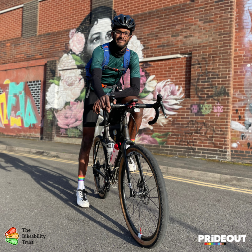 Varun smiling sitting on his bike 