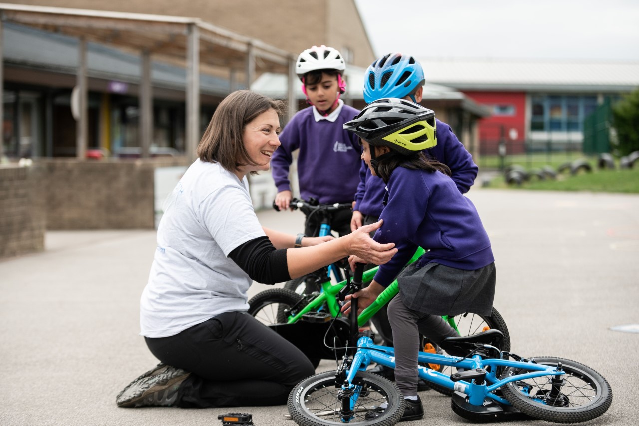Instructor Emily with school children during a Bikeability lesson