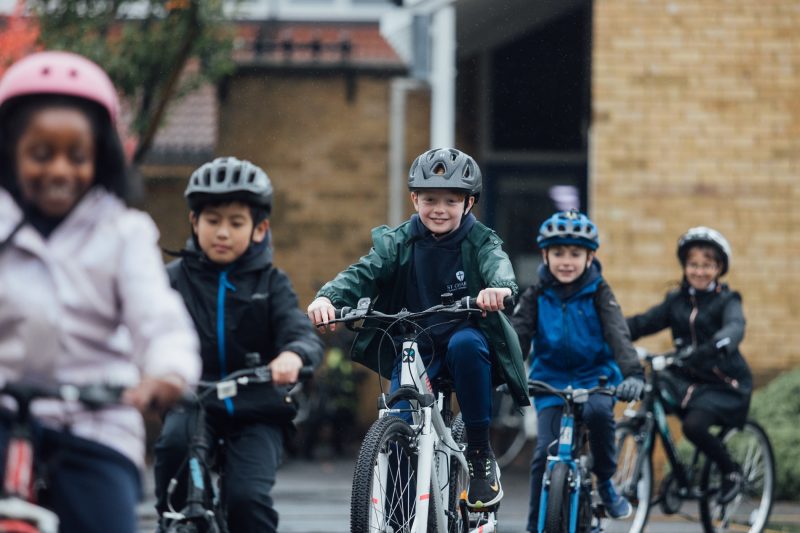 Children_cycle_on_the_playground