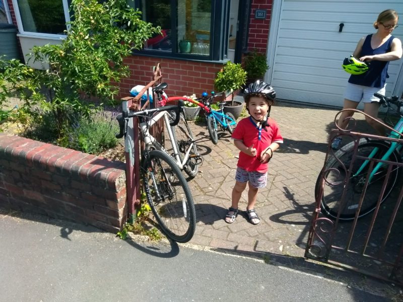 Family preparing to cycle together