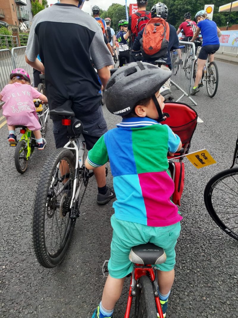 Young boy on a group cycle ride