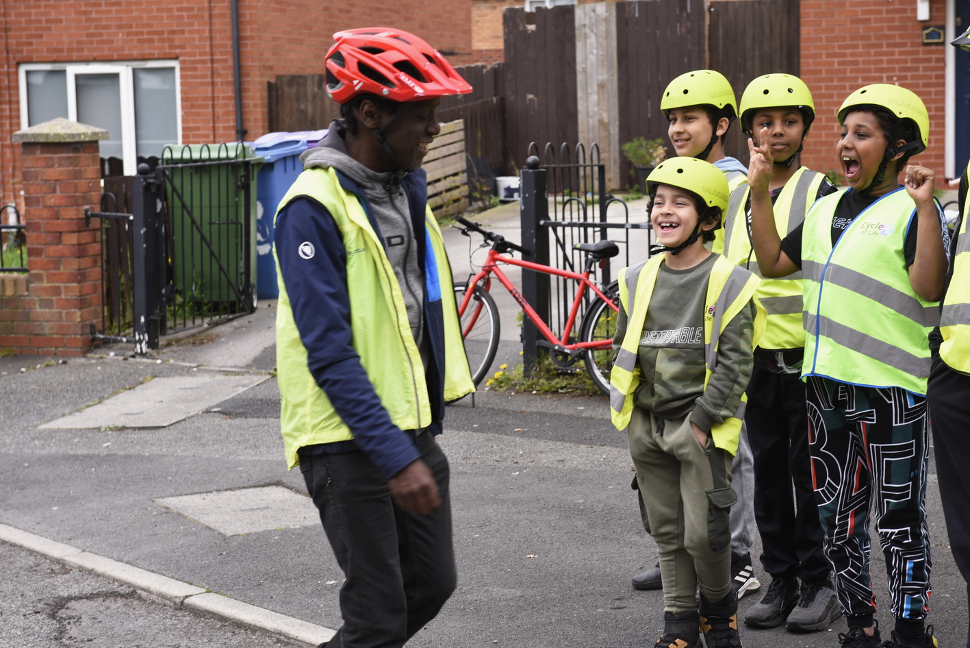 A group of trainees chatting with their Bikeability instructor