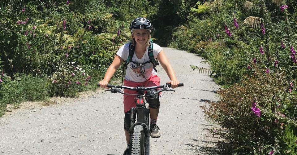 Hannah on her bike smiling