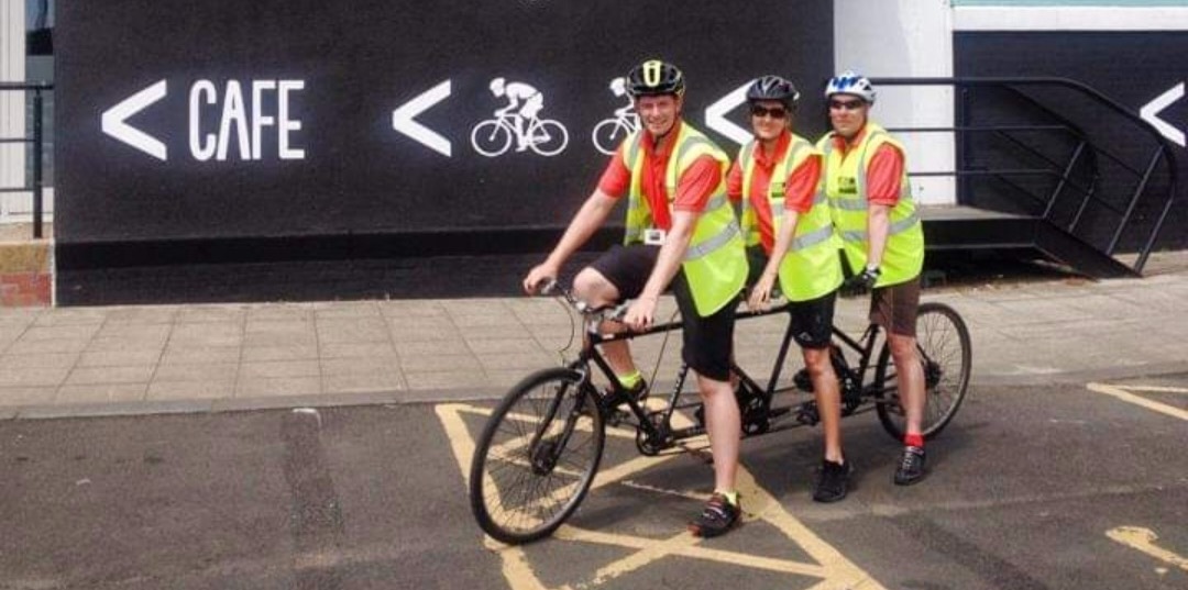 Wayne and colleagues on a multi person bike