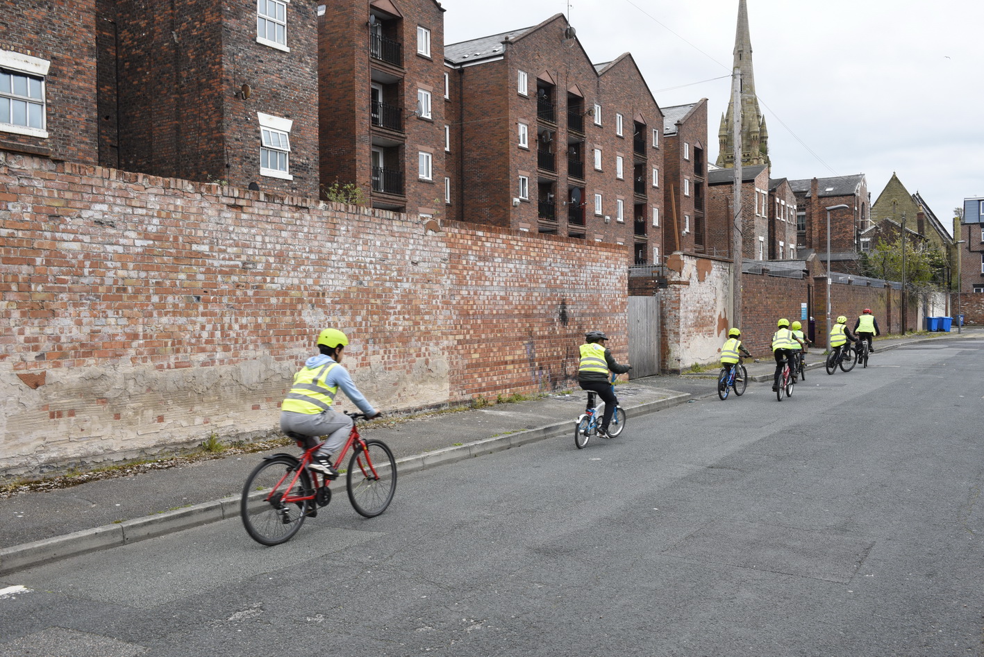 A group of children cycling together