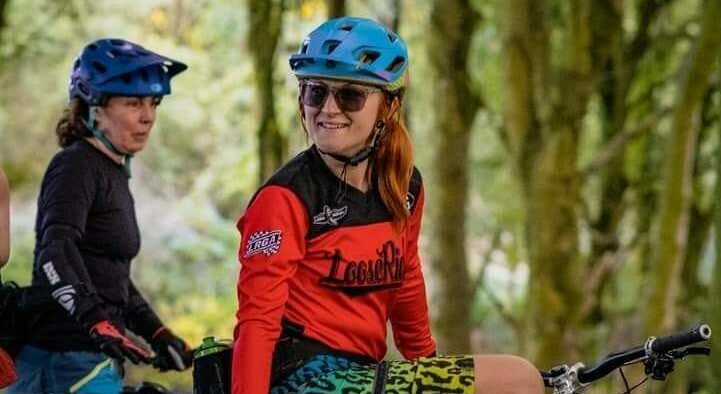 Emma on her bicycle in the woods