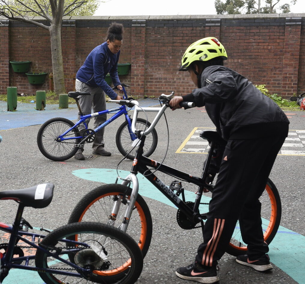 A Bikeability student and their instructor carry out an ABC check