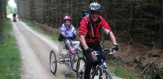 Rob and Hayley using a piggyback trike