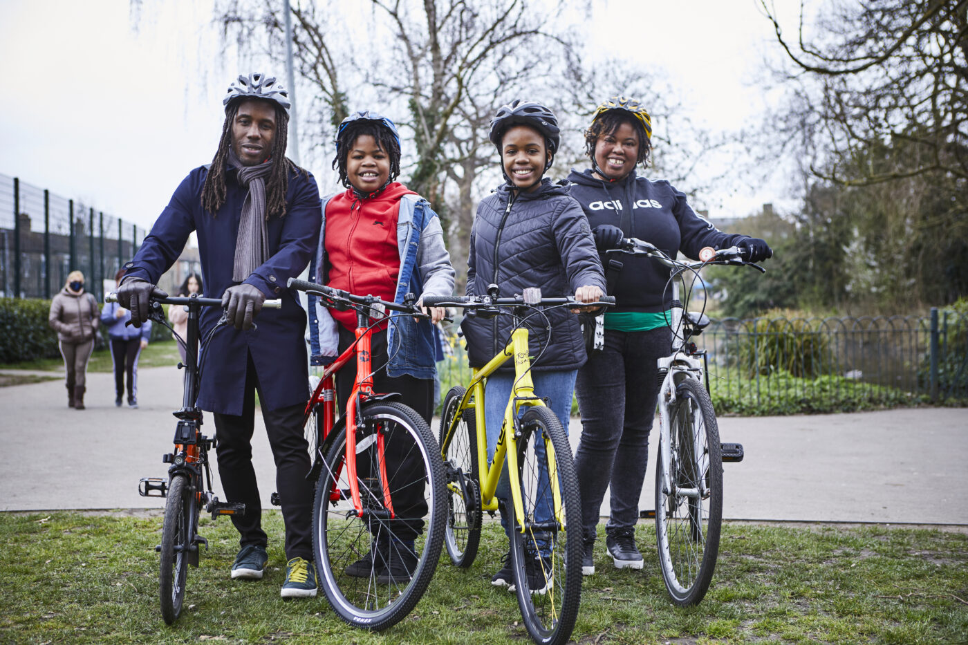 A family of four with their cycles lined up in a park ready to tackle a great cycle route