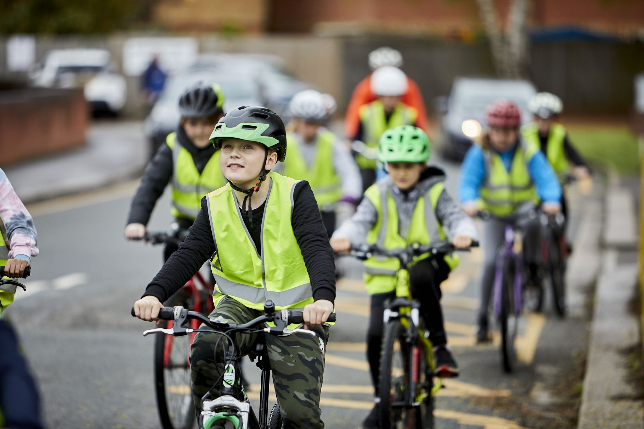 A group of Bikeability riders having a lesson on the road