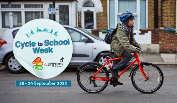 Cycle to school week banner. A young boy on a bike is cycling along the road. There is a sticker on the image that says Cycle to School Week 25 to 29 September 2023