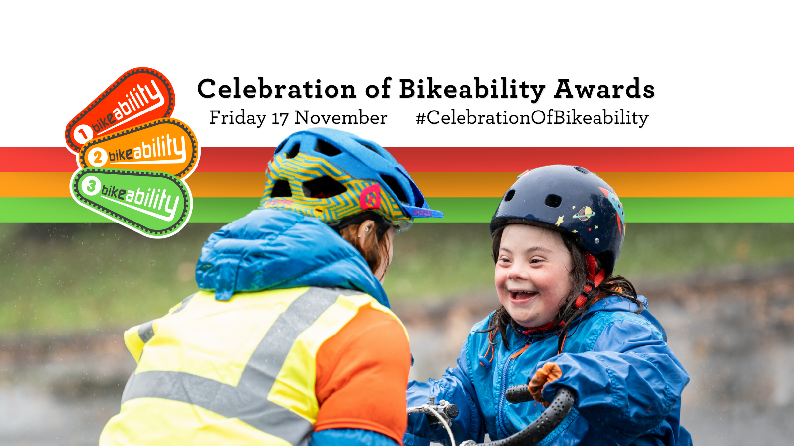 Celebration of Bikeability Awards Friday 17 November. A Bikeability instructor is talking to a girl on a tricycle who has a big smile on her face
