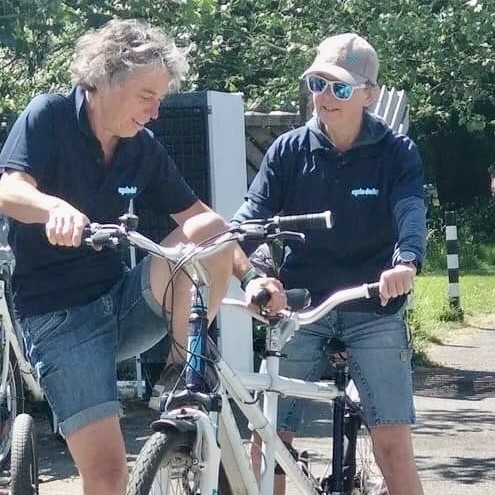 Nicky with a friend on a tandem